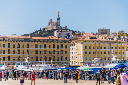 Marseille France. 22 june 2019. A View of the old port vieux Port and Basilique Notre Dame de la Garde in the distance in Marseille in Franceのeditorial素材