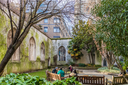 London. February 2020. People relaxing in St Dunstans in The EAst ruins, Londonのeditorial素材