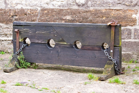 Old English stocks for holding and humiliating wrong doersの写真素材