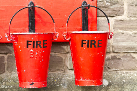 Two slightly battered hanging fire bucketsのeditorial素材