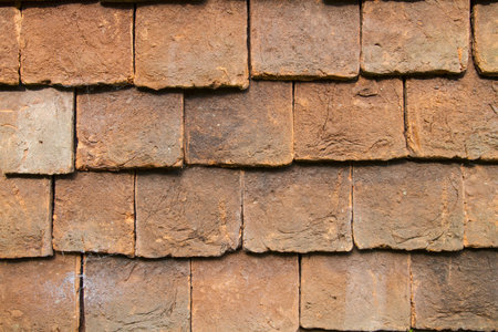 Close up of clay external wall tiles used to partially clad the outside of buildings . Weald,Englandの写真素材