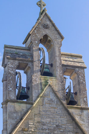 Cotswold village Church bell tower with three bells. St Mary's, Lower Swell, Gloucestershire,England,UKの写真素材