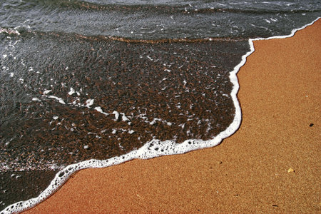 wave on sandの写真素材
