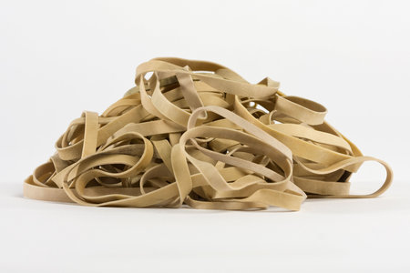Rubber band pile on white backgroundの写真素材