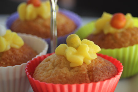 Vanilla cupcakes with lemon frosting on a cake standの写真素材