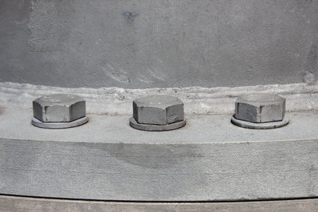 Large bolts mounted to industrial chimneyの写真素材