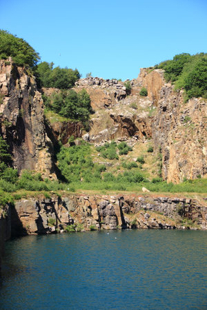 Lake with cliffs and blue skyの写真素材