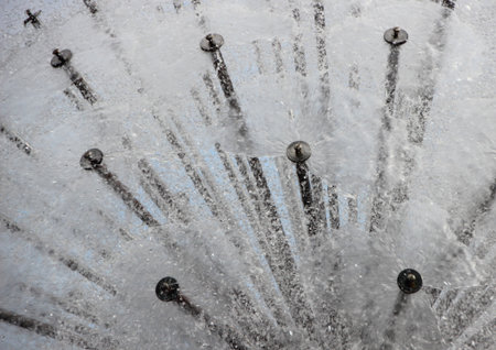 Water Splash Abstract Background from Circular Steel Tube Fountainの写真素材