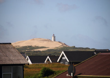 Landscape with Summer houses and Rubjerg Knude Lighthouse in Backgroundの写真素材