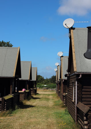 Alley with Asphalt Roof Houses and Satellite Dish in Daylightの写真素材