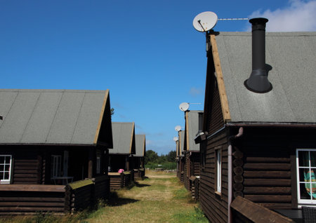 Alley with Asphalt Roof Summer Houses and Satellite Dish in Daylightの写真素材
