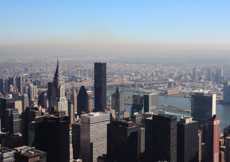 East River in Manhattan New York with Skyline in Morning Smogのeditorial素材