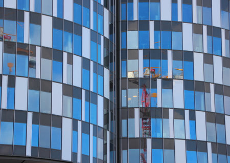 Round Urban Building Abstract with Window Reflection. Apartments are Build around a closed Granaryの写真素材