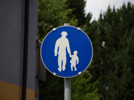 Isolated Blue Pedestrian Traffic Sign with Man and Childの写真素材
