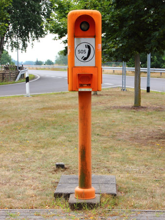 Orange European Highway Emergency Rescue Telephone Post Closeupの写真素材