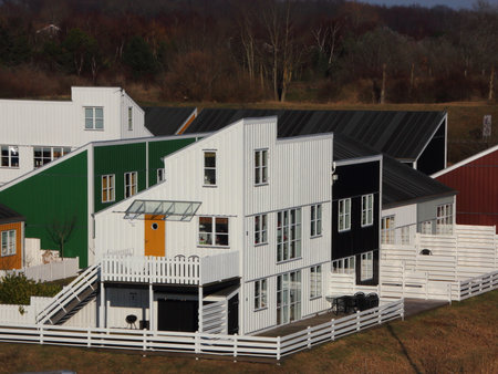 Colorful Wooden Houses with White Fences in Aerial Perspectiveの写真素材