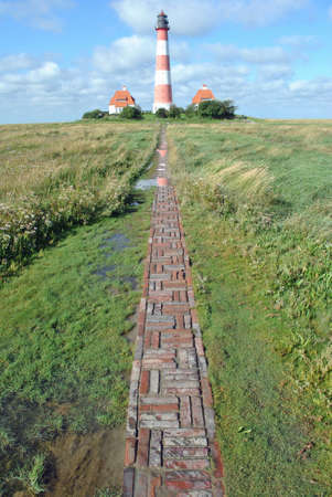 way with stone plates to lighthouse in germany