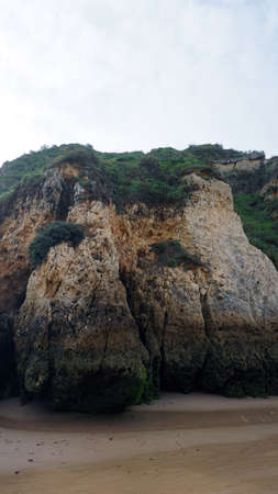 massive rocks on the beach of prainha on the algarveの写真素材