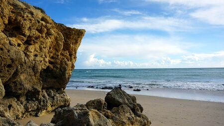 beach of oura on the algarve coast of portugalの写真素材