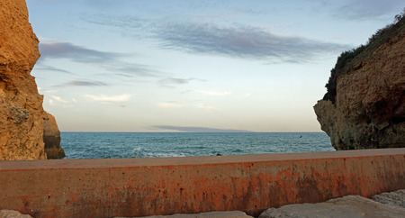dusk on albufeira beach in portugalの写真素材