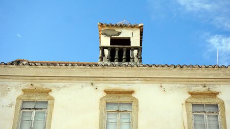 colorful house on the algarve coast in portugalの写真素材