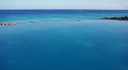 relax in the warm water of a hot tub near the seaの写真素材
