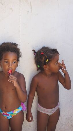 dominican republic 2017, small children collecting sweets from touristsのeditorial素材