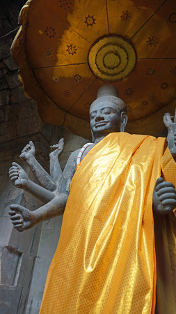statue of buddha in the angkor wat temple complexの写真素材
