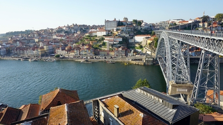 scenic cityscape of portuguese town porto with douro river and bridgeのeditorial素材