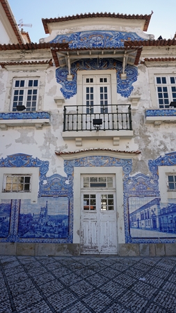 old and colorful train station of aveiro in portugalの写真素材