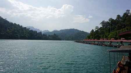 Floating hotel houses and blue sky in khao sok