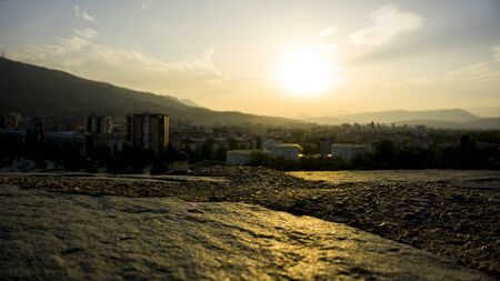 orange sky during sunset over skopje in autumnの写真素材