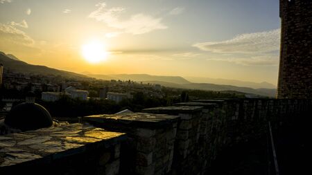 orange sky during sunset over skopje in autumn