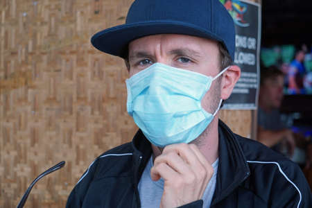 vietnam, circa february 2020: german man wearing mask against covid virusのeditorial素材