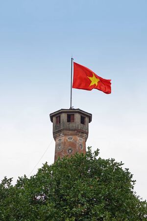 old flag tower in hanoi with vietnamese flagの写真素材