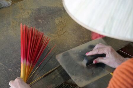 factory producing colorful incense sticks in vietnam