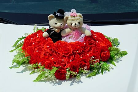 cute small stuffed animals as a decoration for a wedding carの写真素材