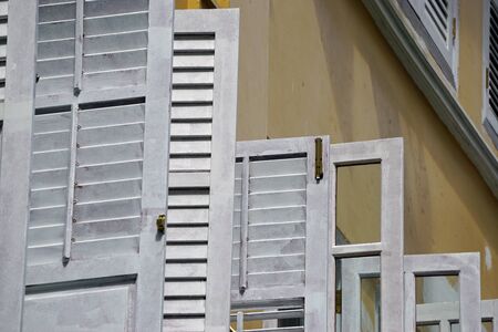 colorful old wooden window shutters in singaporeの写真素材