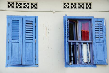 colorful old wooden window shutters in singaporeの写真素材