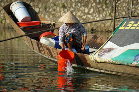 hue, vietnam, circa february 2020: local people on the perfume river