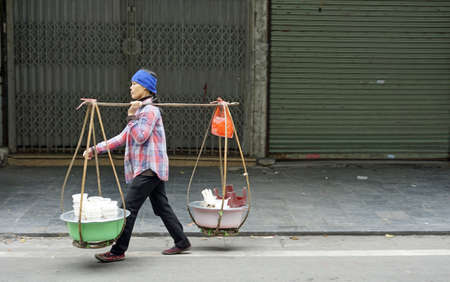 hanoi, vietnam, circa january 2020: local vendors selling their products on an streetmarketのeditorial素材