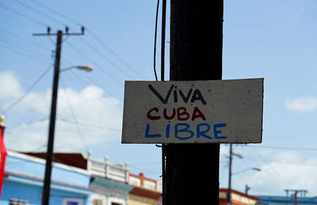 sign contains viva cuba lible in the strees of havanaの写真素材