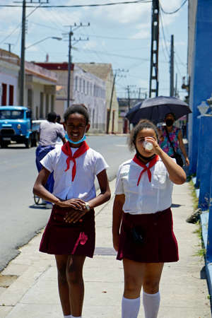 Cienfuegos, Cuba, circa May 2022: two young girls in traditional school uniformのeditorial素材