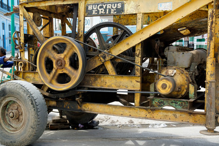 Havana, Cuba, circa May 2022: run down road construction machine in havana