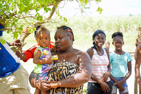 La Romana, Dominican Republic, circa September 2022 - poor children in a run down farm worker...