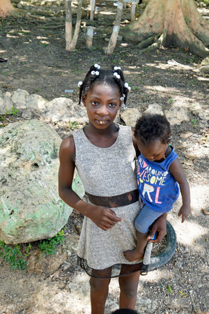 La Romana, Dominican Republic, circa September 2022 - poor children in a run down farm worker villageのeditorial素材