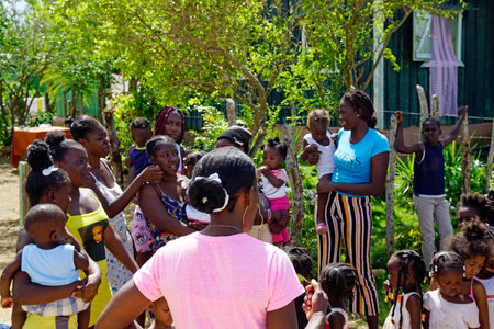 La Romana, Dominican Republic, circa September 2022 - poor children in a run down farm worker villageのeditorial素材