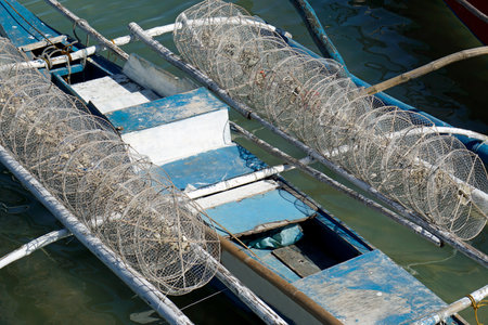 traditional small wooden outrigger boats at a fisherman village