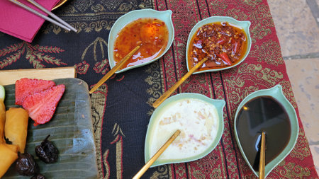 fresh tasty spring rolls on a banana leaf