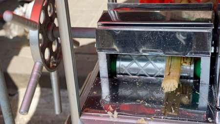 sugar cane press at a food market in phnom penh